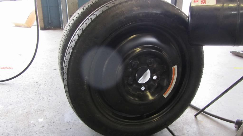 Where is the spare tire on a 2004 nissan quest
