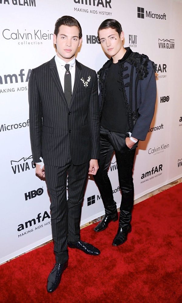 Peter Brant Jr Dior Homme Fall Winter 2014 pinstripe suit with lily of the valley and Harry Brant Marc Jacobs Spring Summer 2014 tassels blue coat amfAR Inspiration Gala 10 June 2014 New York City
